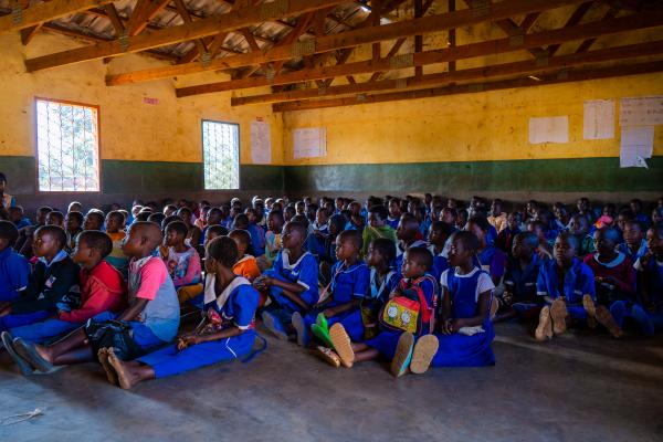 Children in overcrowded classroom