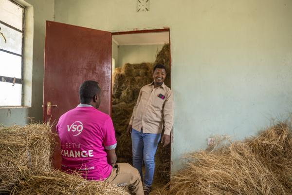 Volunteer in hay store